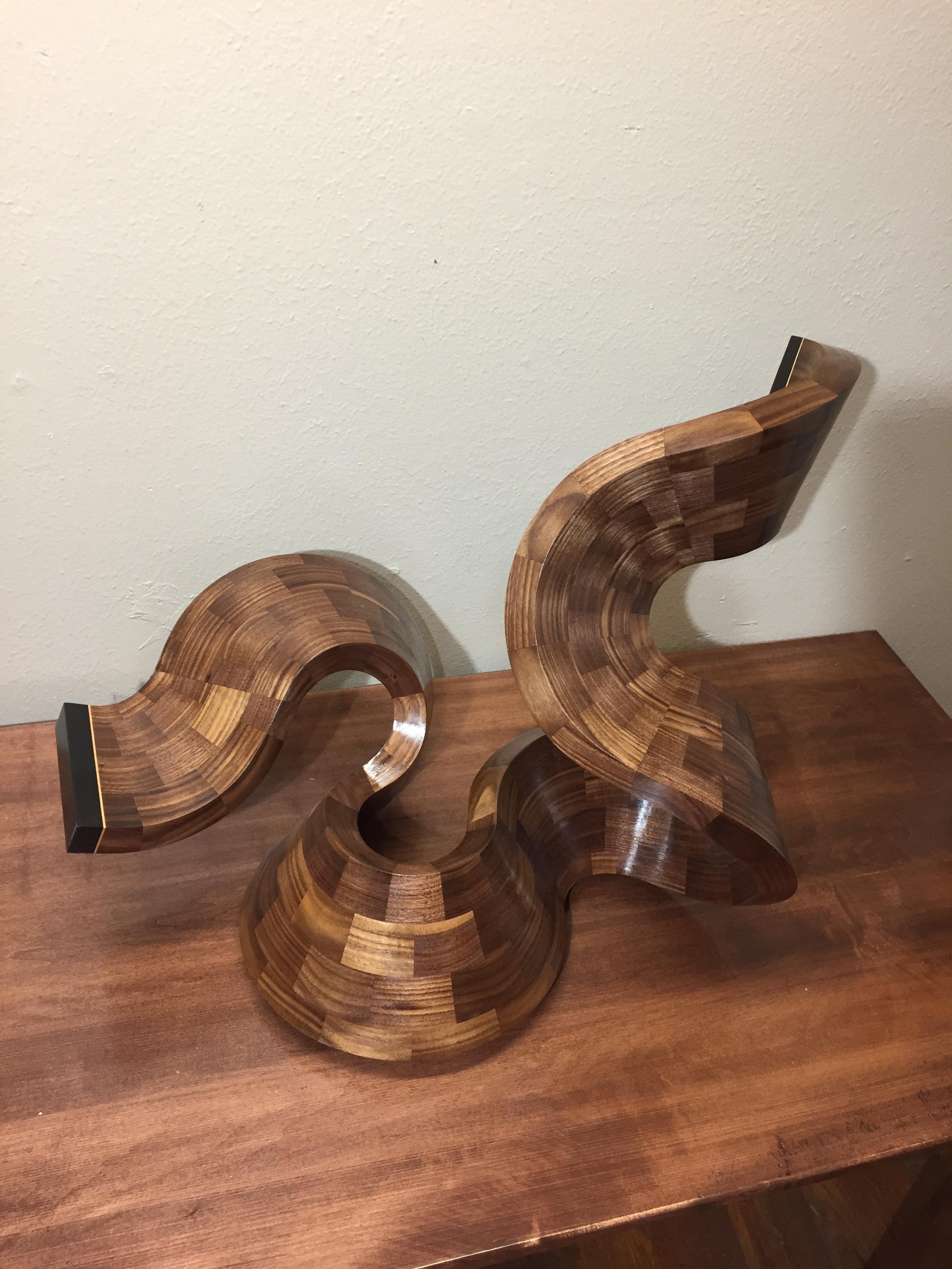 I made a sculpture. Walnut, african blackwood, and maple veneer.